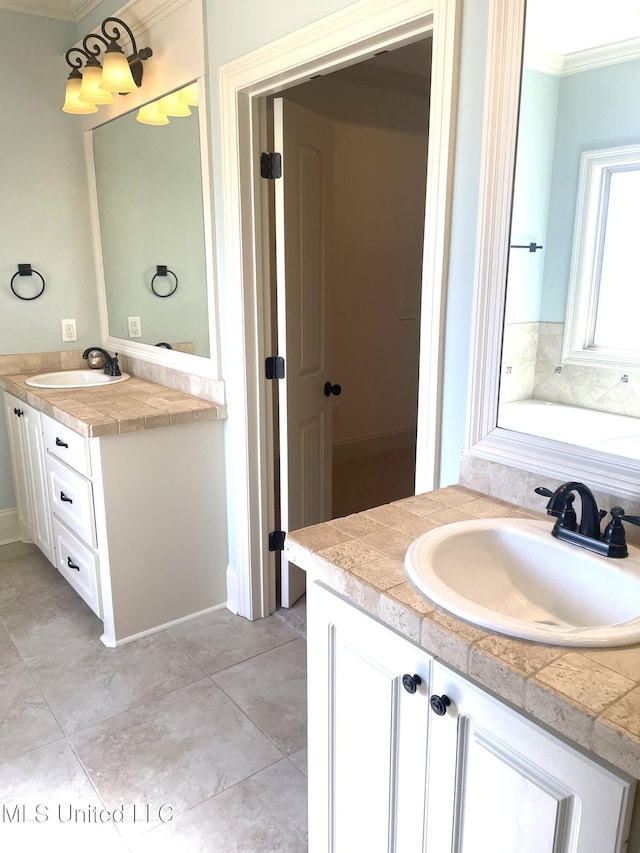 bathroom with tile patterned floors, vanity, and crown molding