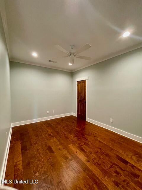 unfurnished room featuring hardwood / wood-style floors, ceiling fan, and crown molding