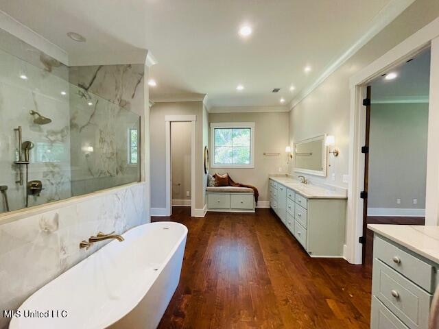 bathroom featuring separate shower and tub, crown molding, hardwood / wood-style floors, and vanity