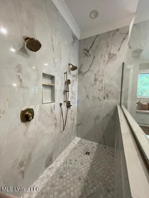 bathroom with tiled shower