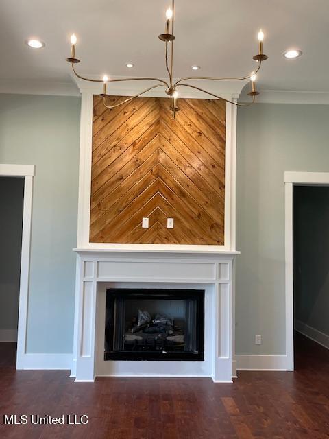 room details with hardwood / wood-style floors and ornamental molding