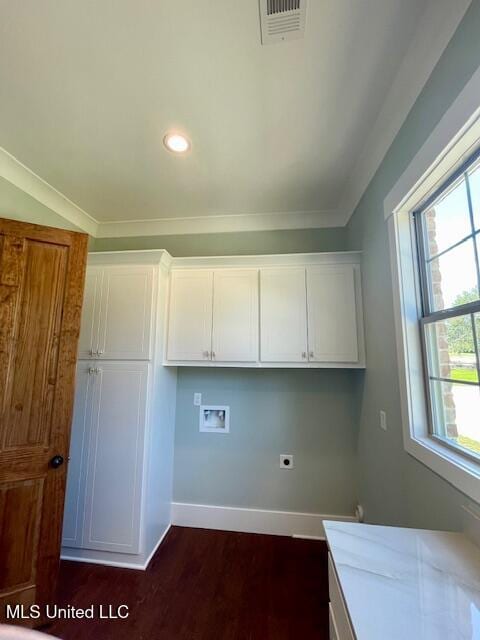 laundry room with cabinets, hookup for a washing machine, electric dryer hookup, and ornamental molding