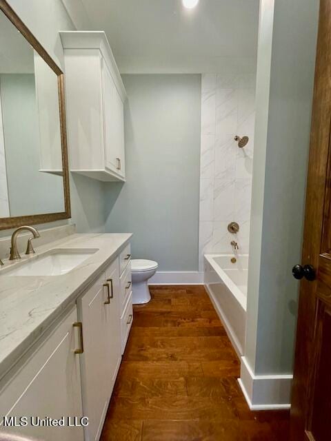 full bathroom with vanity,  shower combination, toilet, and wood-type flooring