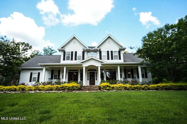 traditional-style home with covered porch and a front lawn