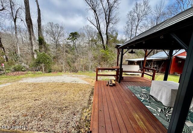 wooden deck with a yard