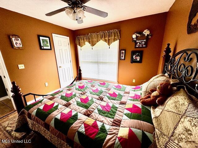 bedroom featuring ceiling fan