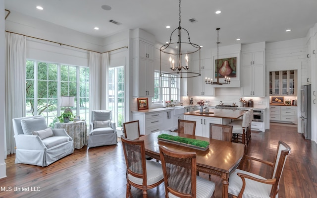 381 Parkinson Rd, Flora, MS 39071 - dining room featuring a chandelier, recessed lighting, and wood finished floors