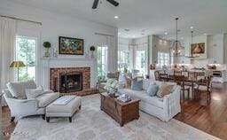 381 Parkinson Rd, Flora, MS 39071 - living area featuring a fireplace, ceiling fan, and wood finished floors