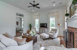 381 Parkinson Rd, Flora, MS 39071 - living room featuring a brick fireplace, ceiling fan, wood finished floors, and recessed lighting