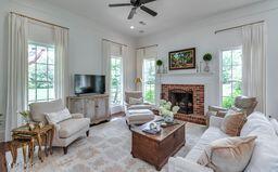 381 Parkinson Rd, Flora, MS 39071 - living area featuring ceiling fan and a brick fireplace