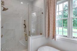 381 Parkinson Rd, Flora, MS 39071 - bathroom featuring a shower stall and a freestanding bath