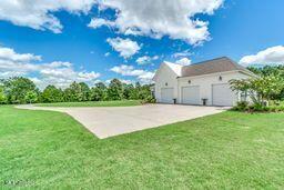 381 Parkinson Rd, Flora, MS 39071 - view of green lawn with driveway
