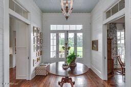 381 Parkinson Rd, Flora, MS 39071 - foyer entrance featuring plenty of natural light, wood finished floors, and a chandelier