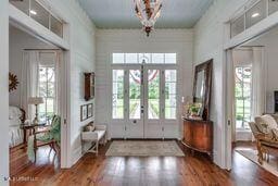 381 Parkinson Rd, Flora, MS 39071 - doorway to outside featuring wood finished floors, a towering ceiling, and french doors