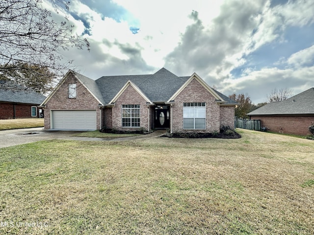 view of front of house featuring a garage and a front yard