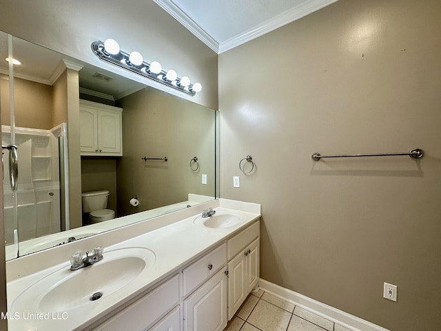 bathroom featuring tile patterned flooring, vanity, toilet, and ornamental molding