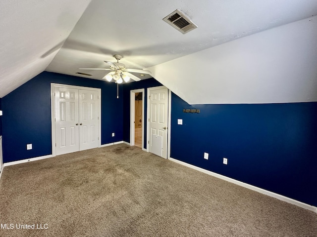 bonus room with carpet, ceiling fan, and lofted ceiling