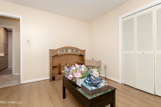 bedroom featuring a closet and light wood-type flooring