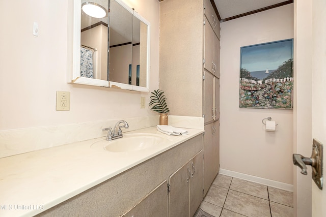 bathroom with vanity, ornamental molding, a textured ceiling, and tile patterned flooring