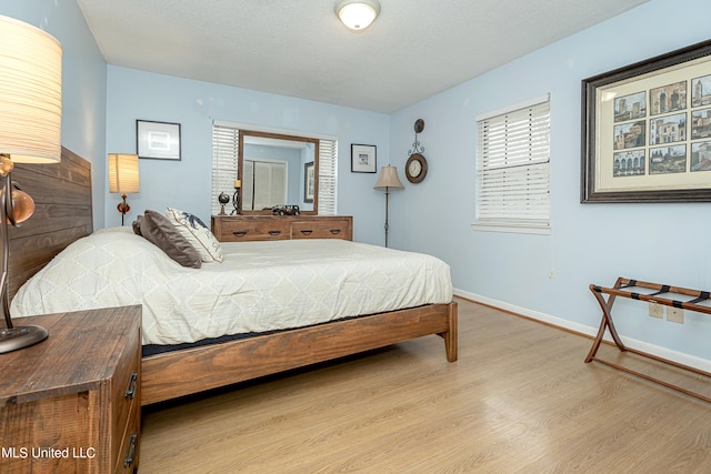 bedroom with light hardwood / wood-style flooring