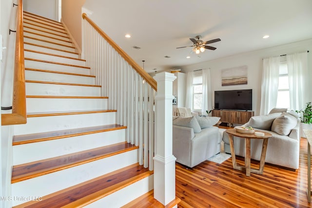 stairs featuring ceiling fan, visible vents, wood finished floors, and recessed lighting