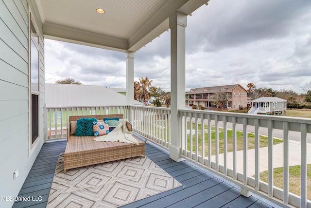 wooden deck featuring a residential view