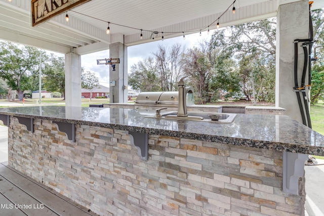 view of patio / terrace featuring a sink and area for grilling