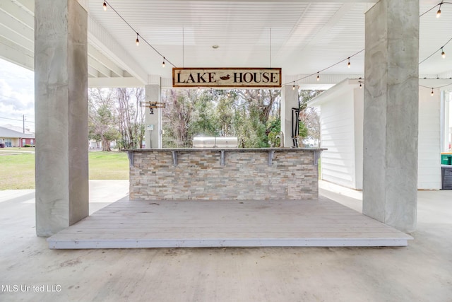 view of patio / terrace with a deck and exterior kitchen