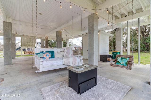 view of patio / terrace featuring an outdoor living space with a fire pit