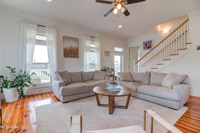 living room with ornamental molding, stairway, wood finished floors, and recessed lighting