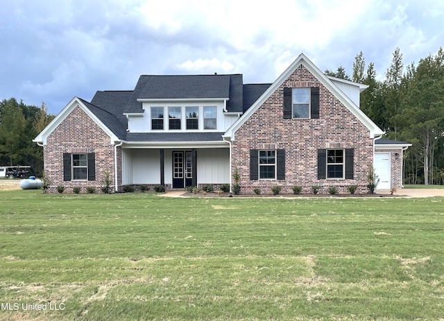 view of front of home with a front lawn and a garage