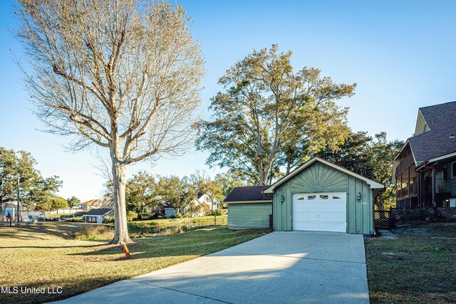 garage featuring a lawn