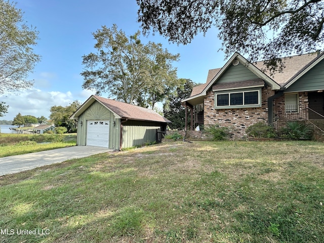 view of property exterior with an outdoor structure, a garage, and a yard