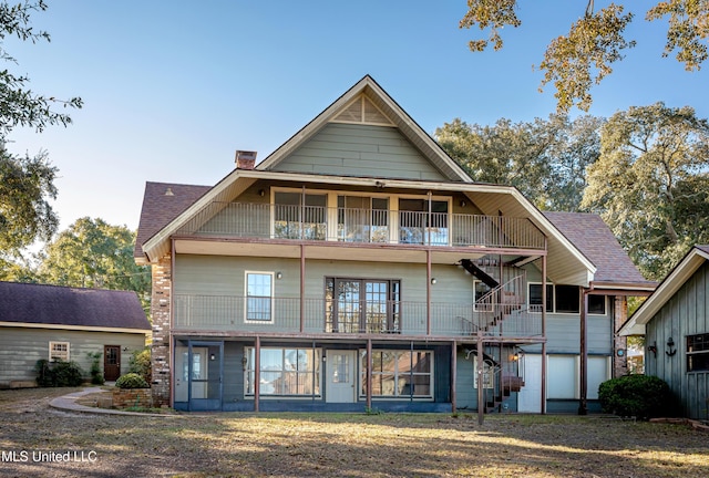 back of house with a balcony