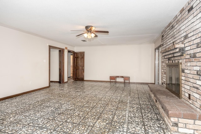 unfurnished living room featuring a textured ceiling, ceiling fan, ornamental molding, and a fireplace