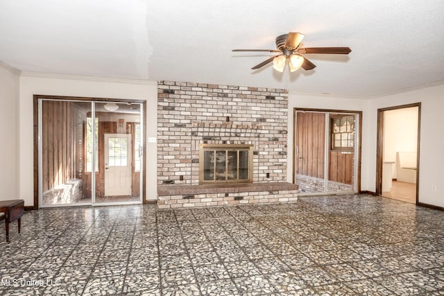 unfurnished living room with ceiling fan, ornamental molding, a textured ceiling, and a brick fireplace