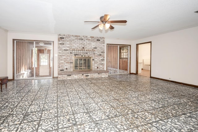 unfurnished living room with a textured ceiling, ceiling fan, a fireplace, and crown molding