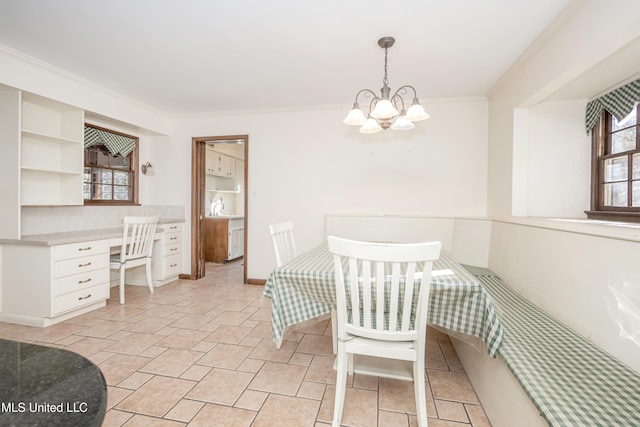 dining space featuring a chandelier and ornamental molding