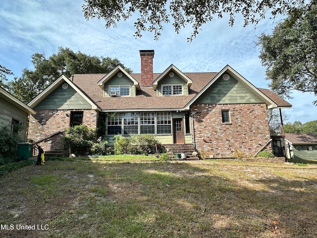 back of house featuring a yard