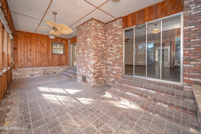 view of patio featuring ceiling fan