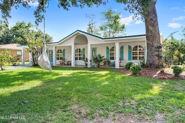 single story home with covered porch and a front yard