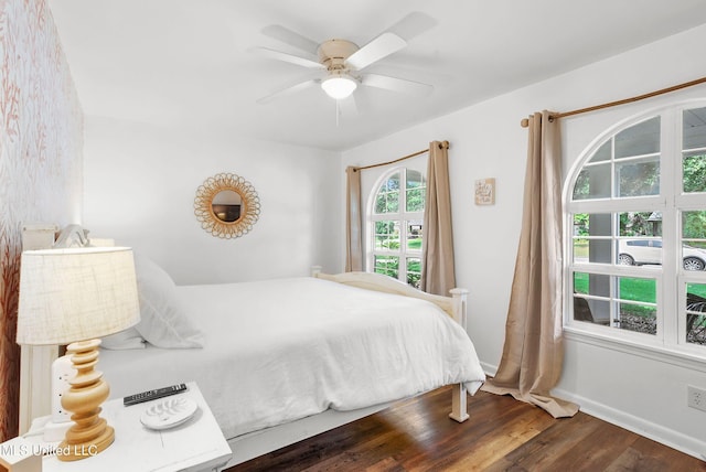 bedroom featuring dark hardwood / wood-style flooring and ceiling fan