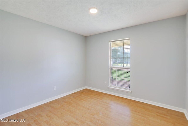 143 Glenwood Dr, Madison, MS 39110 - empty room featuring light wood-style floors and a textured ceiling