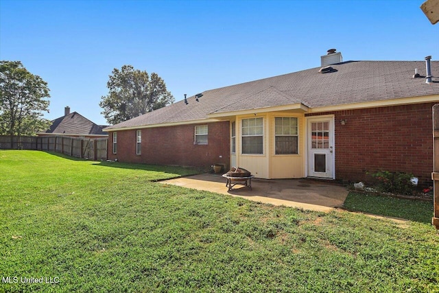 143 Glenwood Dr, Madison, MS 39110 - back of house featuring a patio area, a fire pit, brick siding, and a chimney