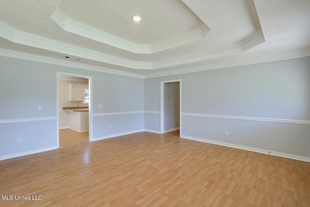 143 Glenwood Dr, Madison, MS 39110 - empty room with crown molding, a raised ceiling, light wood-type flooring, and recessed lighting