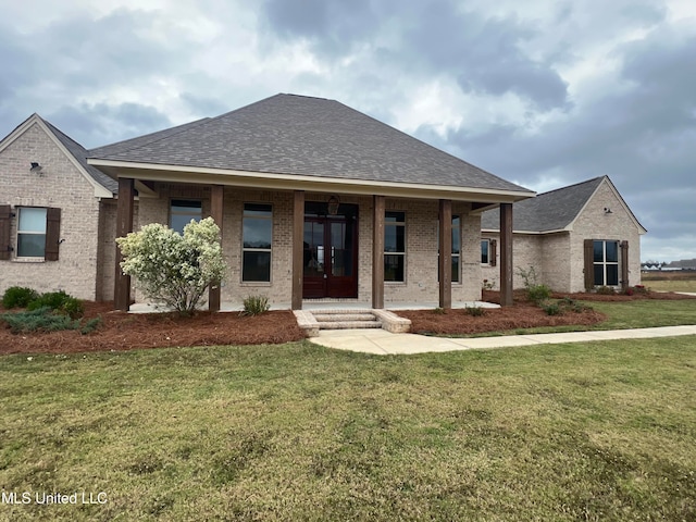 view of front of home featuring a porch and a front yard