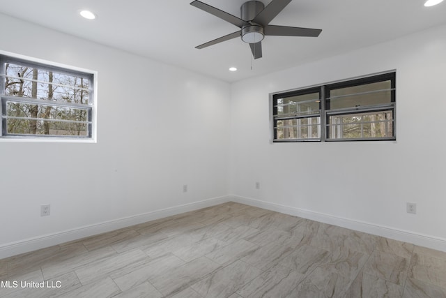 spare room with recessed lighting, ceiling fan, and baseboards