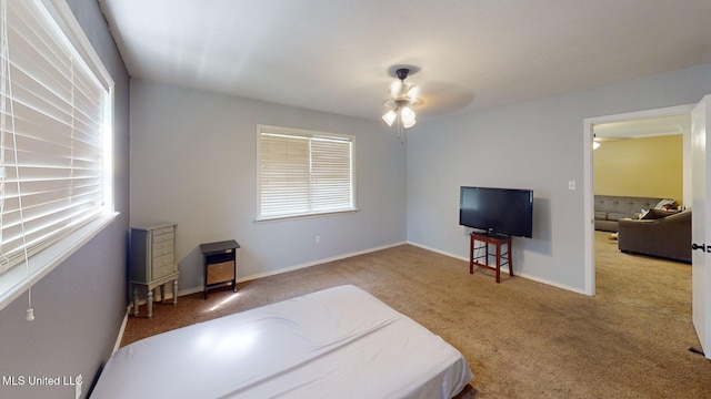 6400 Hans Rd, Moss Point, MS 39562 - carpeted bedroom with baseboards and a ceiling fan