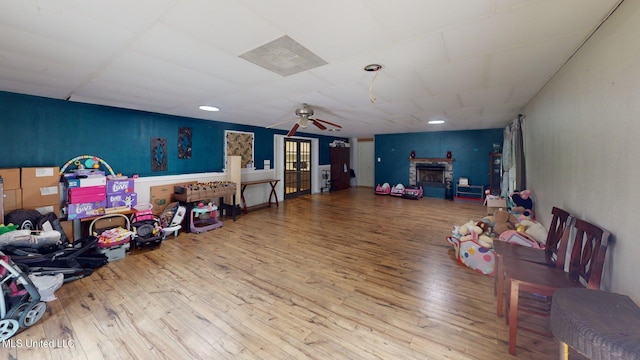 6400 Hans Rd, Moss Point, MS 39562 - game room with hardwood / wood-style floors, ceiling fan, and a fireplace