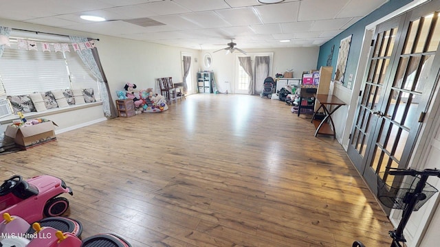 6400 Hans Rd, Moss Point, MS 39562 - playroom featuring ceiling fan, wood-type flooring, french doors, and baseboards